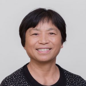 A headshot of Julia Wang
