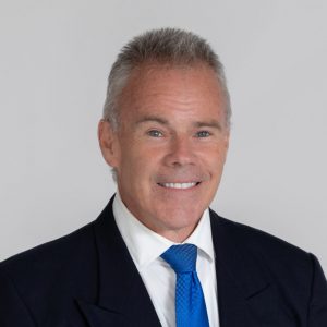 A headshot of Tim Kickham