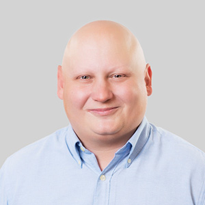 A headshot of Trent Rivers