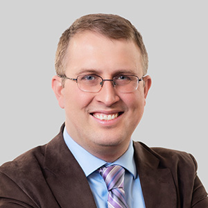 A headshot of Andrew Tilbe